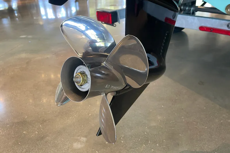 Slide: The Image of 2026 Mako Pro Skiff 15 CC boat propeller, shiny metal finish, close-up view. - 7