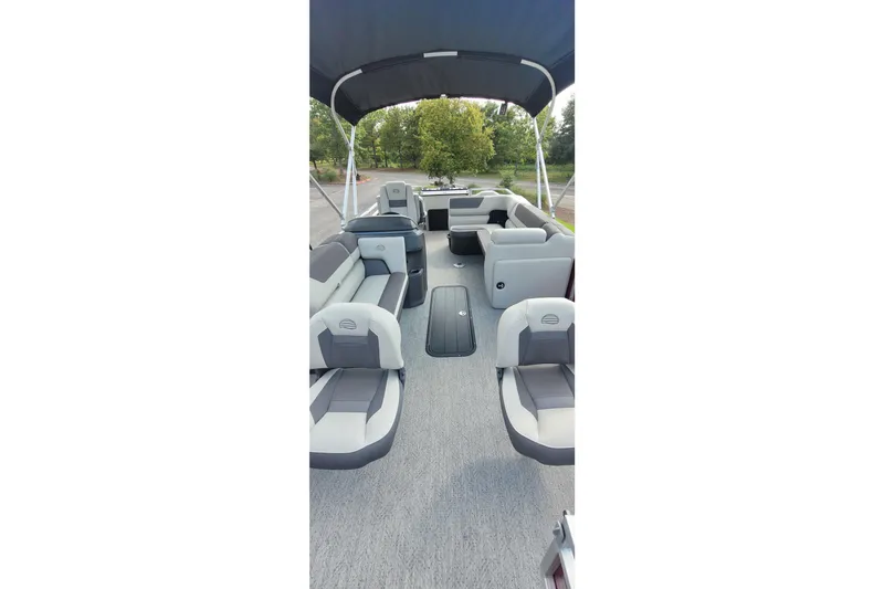 Slide: The Image of 2026 Sun Tracker Fishin' Barge 22 XP3 interior with spacious seating and canopy. - 9