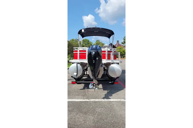 Slide: The Image of 2026 Sun Tracker Fishin' Barge 22 XP3 pontoon boat, rear view with outboard motor. - 10