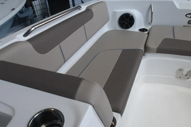 Slide: The Image of 2026 Tahoe 2150 boat interior with cushioned seating and built-in speaker. - 22