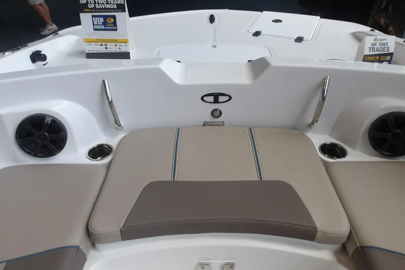 Slide: The Image of Interior view of a 2026 Tahoe 2150 boat, featuring cushioned seating and cup holders. - 24