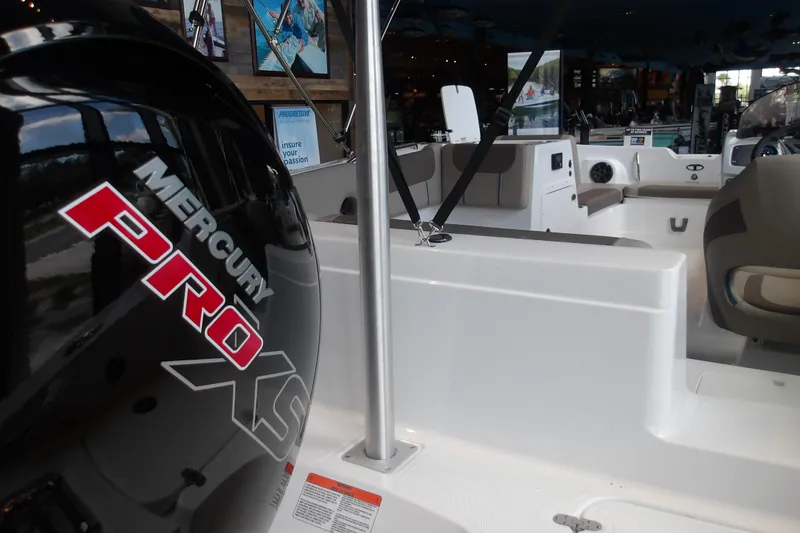 Slide: The Image of 2026 Tahoe 2150 boat interior with Mercury Pro XS engine, showcasing seating and controls. - 14