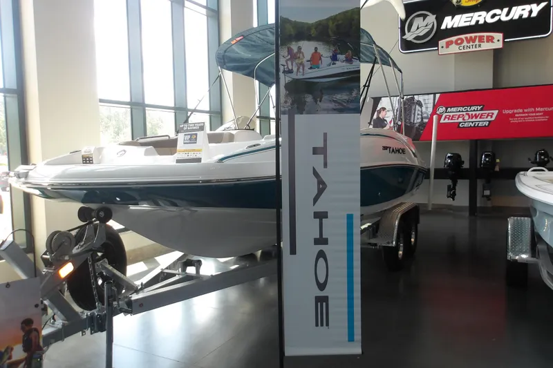 Slide: The Image of 2026 Tahoe 2150 boat displayed at Mercury Power Center showroom. - 5