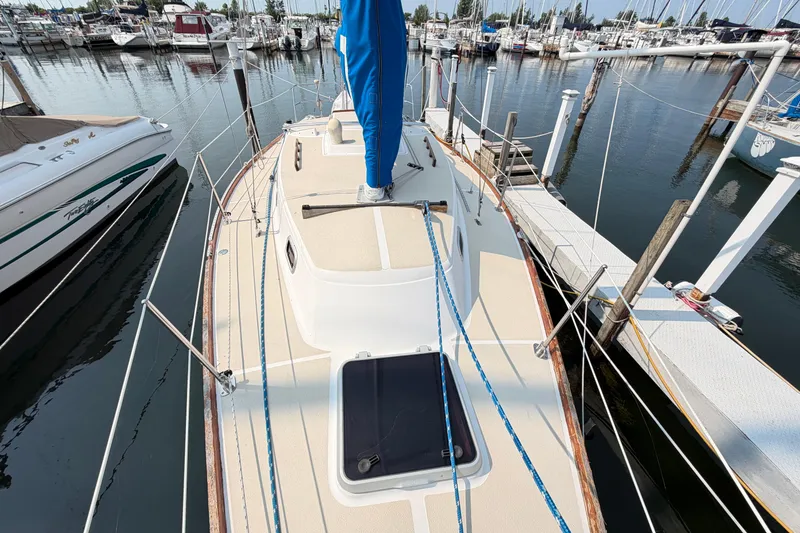 Slide: The Image of Sailboat docked at marina, Tartan 28 Piper, 1991 model, with blue sail cover. - 1