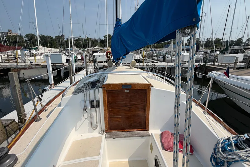 Slide: The Image of Sailboat deck view of 1991 Tartan 28 Piper in marina setting. - 9