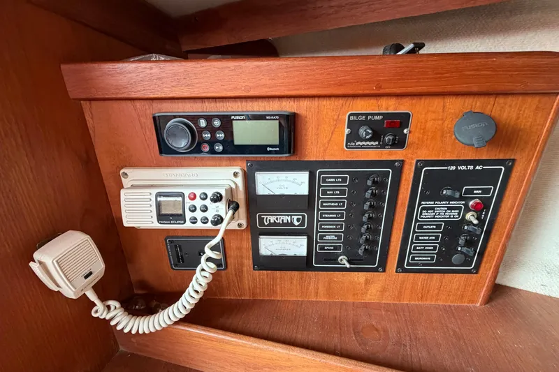 Slide: The Image of Control panel of a 1991 Tartan 28 Piper sailboat with radio and electrical switches. - 15
