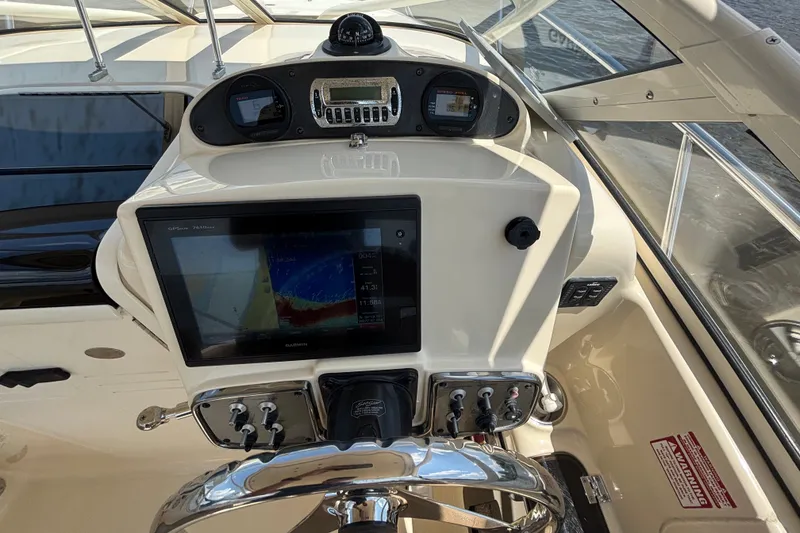 Slide: The Image of Helm of 2011 Scout 225 Abaco boat with Garmin GPS and control panel. - 9