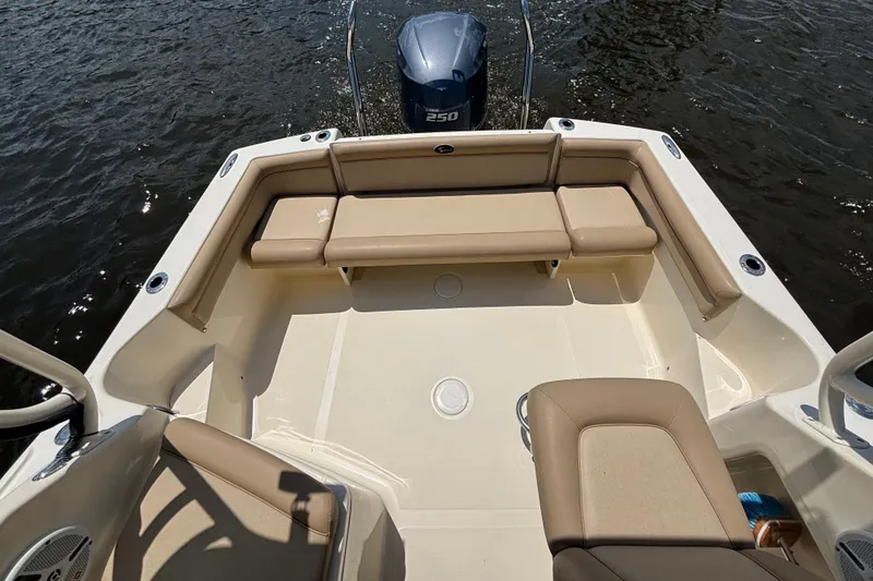 Slide: The Image of 2011 Scout 225 Abaco boat interior with beige seating and Yamaha 250 engine. - 7