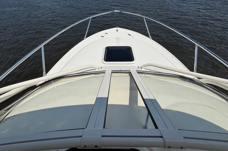 Slide: The Image of 2011 Scout 225 Abaco boat bow view on calm water. - 5