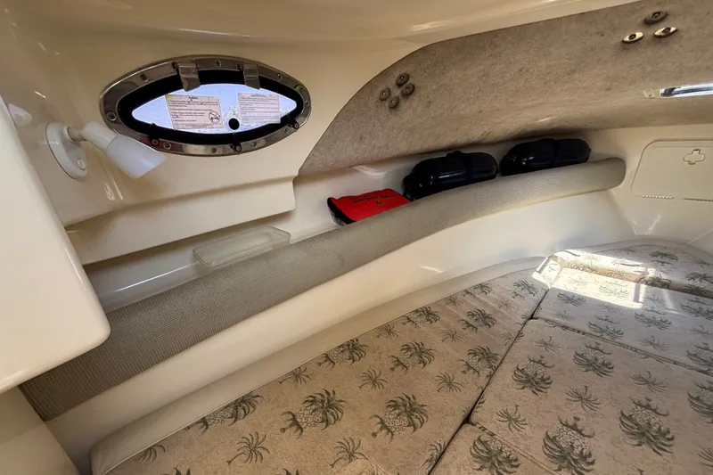 Slide: The Image of Interior cabin of 2011 Scout 225 Abaco boat with patterned cushions and storage. - 11