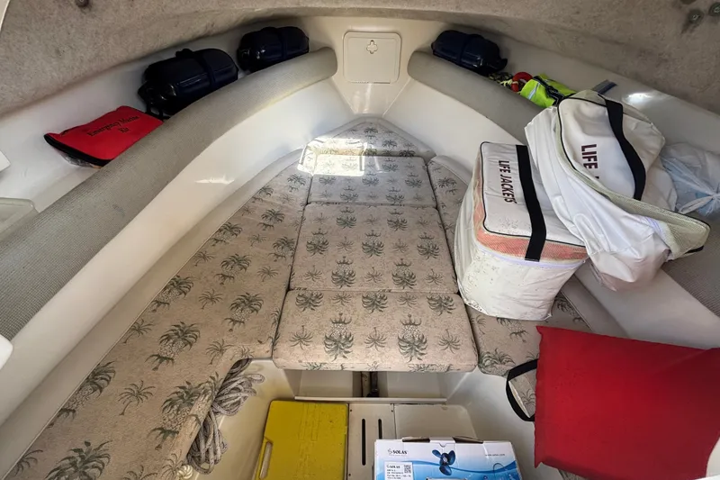 Slide: The Image of Interior of a 2011 Scout 225 Abaco boat with life jackets and emergency kit. - 22