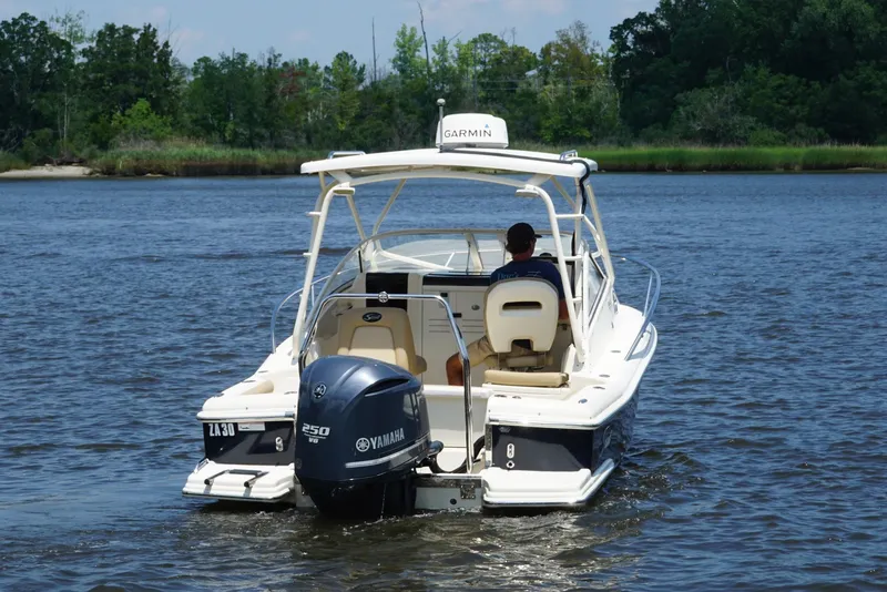 Slide: The Image of 2011 Scout 225 Abaco boat with Yamaha engine on a serene river. - 24