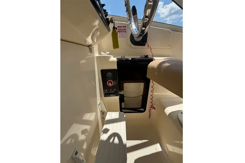 Slide: The Image of Interior view of 2011 Scout 225 Abaco boat cockpit with steering wheel and controls. - 23