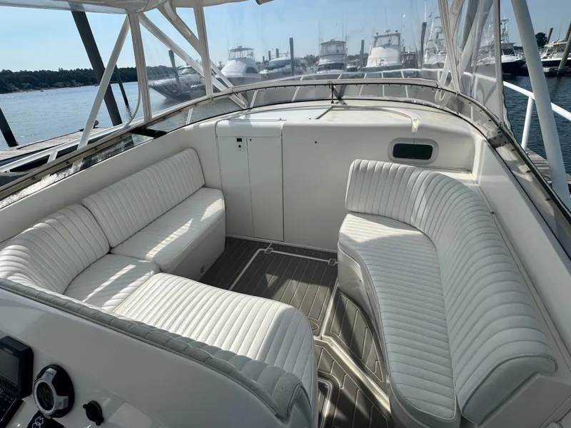 Slide: The Image of The image shows the cockpit of a 2002 Intrepid 377 Walkaround with white upholstered seating. - 8