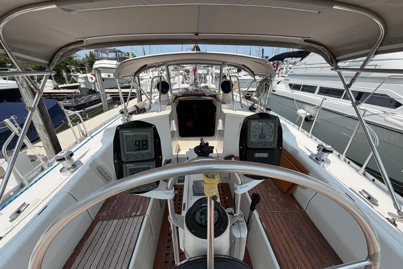 Slide: The Image of Cockpit view of 1988 Beneteau Oceanis 390 sailboat with navigation instruments. - 8