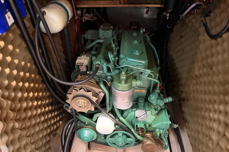 Slide: The Image of Engine compartment of a 1988 Beneteau Oceanis 390 sailboat, featuring a Volvo Penta engine. - 35