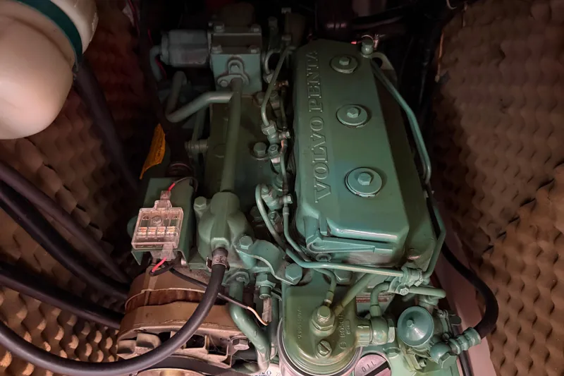 Slide: The Image of Volvo Penta engine in a 1988 Beneteau Oceanis 390 sailboat, showcasing detailed components. - 37