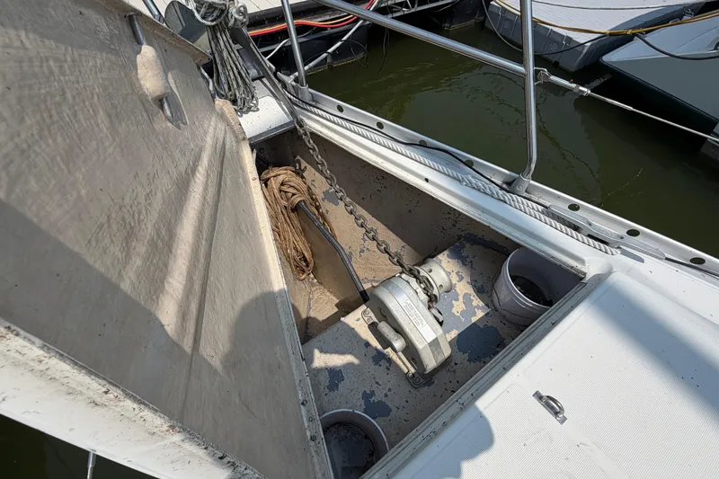Slide: The Image of Anchor locker of a 1988 Beneteau Oceanis 390 sailboat, showing chain and rope storage. - 13