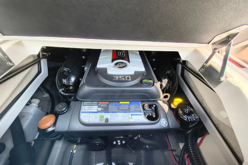 Slide: The Image of Engine compartment of 2023 Crownline 290 SS boat, featuring a Mercury 350 engine. - 15