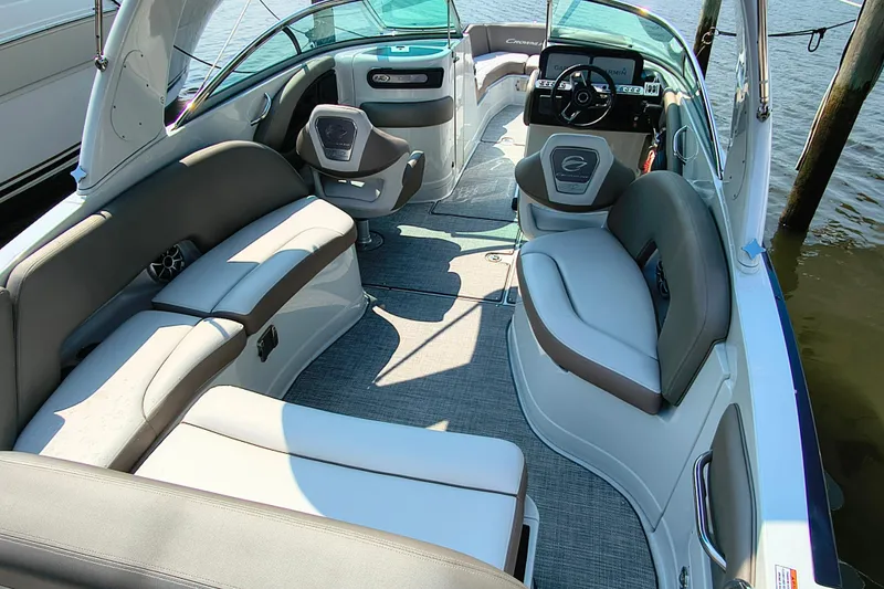 Slide: The Image of 2023 Crownline 290 SS boat interior with luxurious seating and modern dashboard. - 3