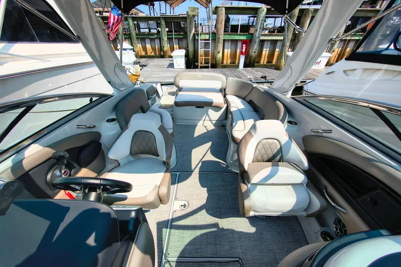 Slide: The Image of 2023 Crownline 290 SS boat interior with luxurious seating and modern design. - 5