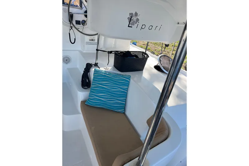 Slide: The Image of Cozy seating area on a 2013 Fountaine Pajot Lipari 41 catamaran with blue cushion. - 8