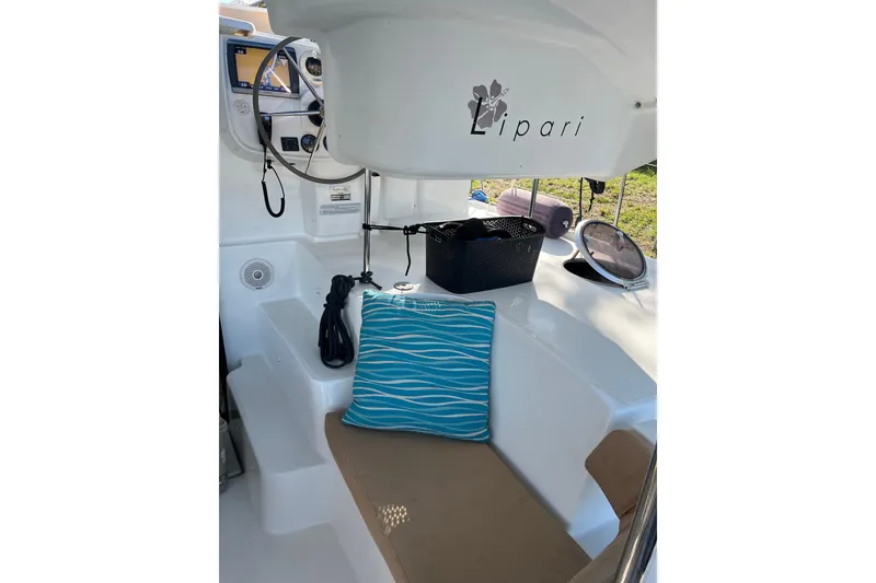 Slide: The Image of Cockpit of 2013 Fountaine Pajot Lipari 41 catamaran with blue cushion and navigation equipment. - 9