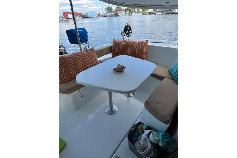 Slide: The Image of Outdoor seating area on 2013 Fountaine Pajot Lipari 41 catamaran with waterfront view. - 6