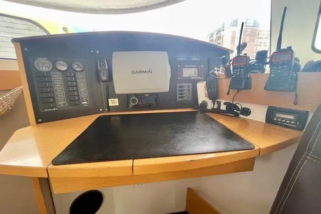 Slide: The Image of Navigation station of 2013 Fountaine Pajot Lipari 41 catamaran with Garmin equipment and communication devices. - 21
