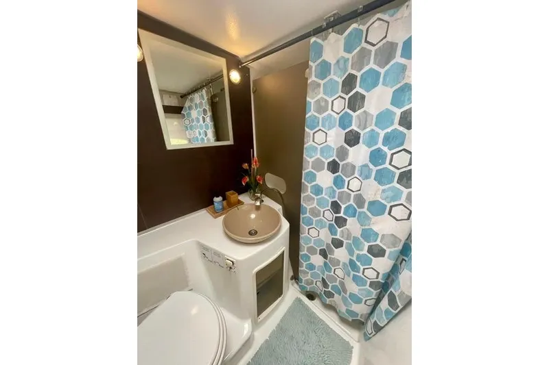 Slide: The Image of Bathroom of 2013 Fountaine Pajot Lipari 41 catamaran with hexagonal shower curtain. - 26