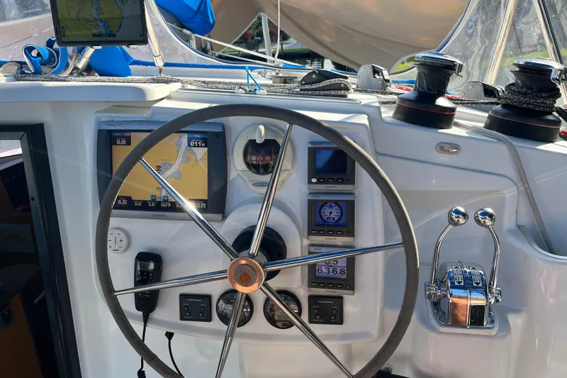 Slide: The Image of Helm of 2013 Fountaine Pajot Lipari 41 catamaran with navigation instruments and controls. - 15