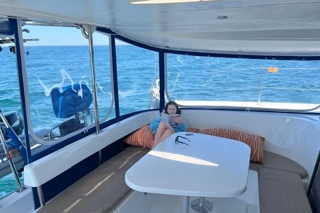 Slide: The Image of Person relaxing on a 2013 Fountaine Pajot Lipari 41 catamaran, enjoying the ocean view. - 2