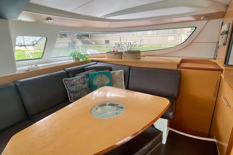 Slide: The Image of Interior of 2013 Fountaine Pajot Lipari 41 catamaran with cozy seating and decorative pillows. - 18