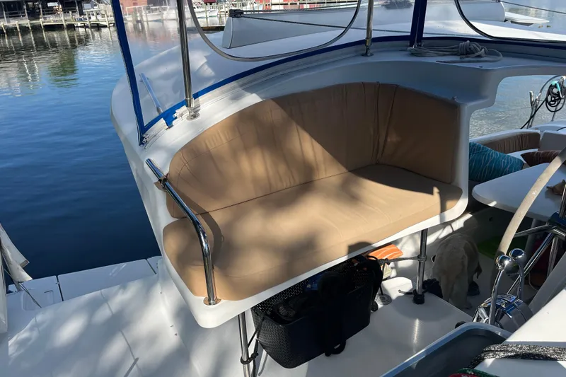 Slide: The Image of Comfortable seating area on a 2013 Fountaine Pajot Lipari 41 catamaran, docked by the water. - 13