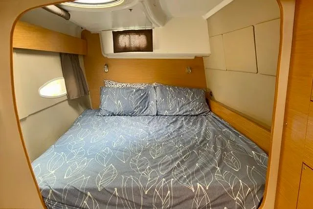 Slide: The Image of Cozy bedroom interior of 2013 Fountaine Pajot Lipari 41 catamaran with patterned bedding. - 25
