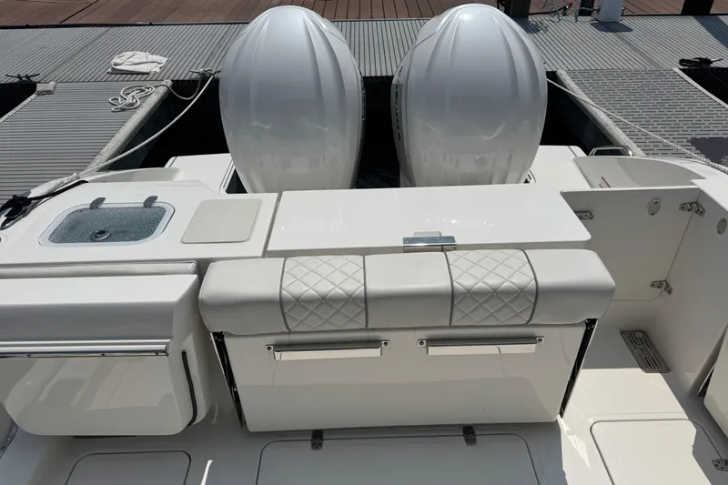 Slide: The Image of 2025 Pursuit DC 306 Dual Console boat with dual engines and sleek deck design. - 9