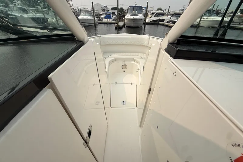Slide: The Image of 2025 Pursuit DC 306 Dual Console boat interior, showcasing sleek design and spacious layout. - 28