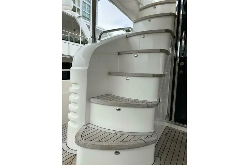 Slide: The Image of Staircase on 2008 Princess 67 Flybridge Motor Yacht with teak steps and sleek design. - 15