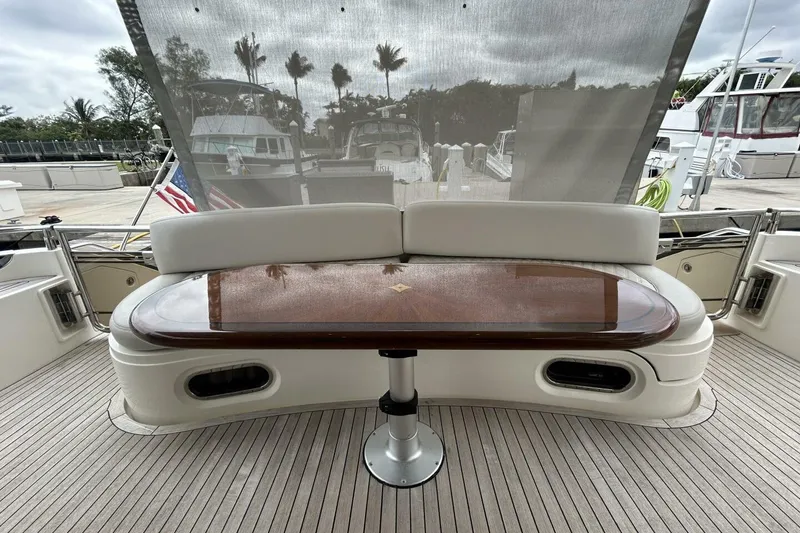 Slide: The Image of Luxurious seating area on a 2008 Princess 67 Flybridge Motor Yacht with elegant wooden table. - 9