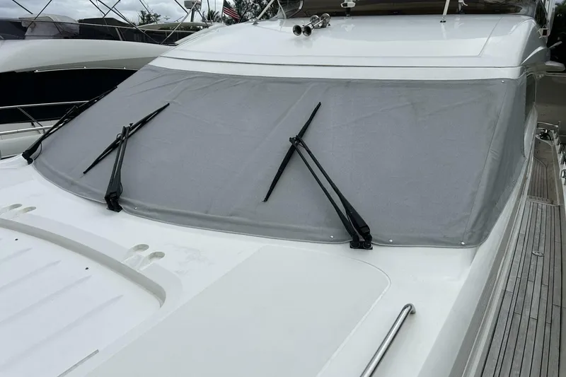 Slide: The Image of 2008 Princess 67 Flybridge Motor Yacht with covered windshield and wipers. - 14