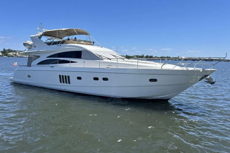 Slide: The Image of 2008 Princess 67 Flybridge Motor Yacht cruising on calm waters under clear skies. - 3