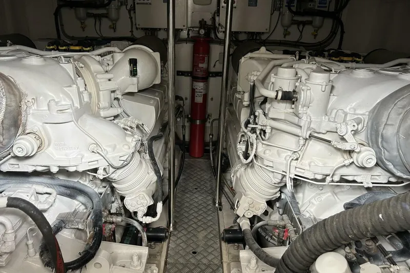 Slide: The Image of Engine room of a 2008 Princess 67 Flybridge Motor Yacht, showcasing dual engines. - 36