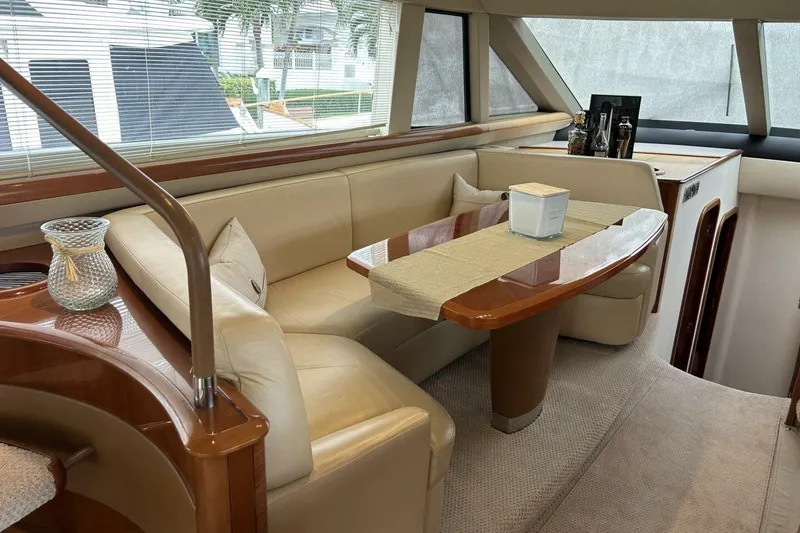 Slide: The Image of Luxurious interior of 2008 Princess 67 Flybridge Motor Yacht with elegant seating and table. - 24