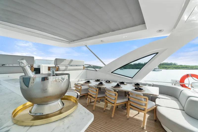 Slide: The Image of Luxurious Azimut Grande 32 Metri yacht deck with elegant dining area, 2022 model. - 26