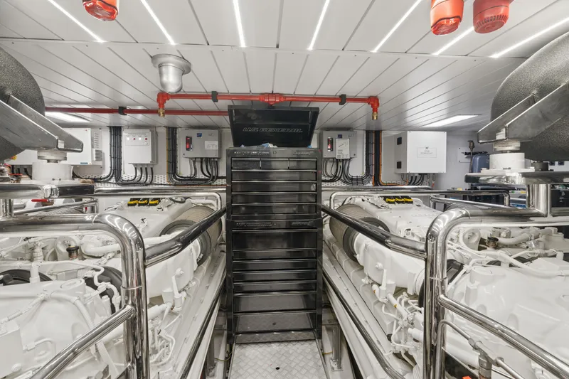 Slide: The Image of Engine room of 2022 Azimut Grande 32 Metri yacht, featuring advanced machinery and controls. - 34