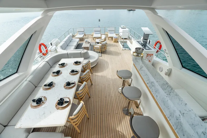 Slide: The Image of Luxurious deck of 2022 Azimut Grande 32 Metri yacht with elegant seating and dining area. - 27