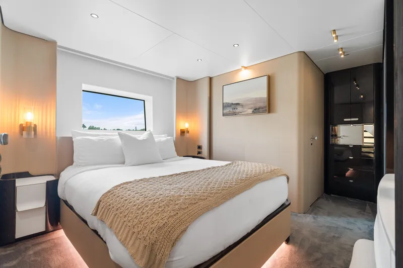 Slide: The Image of Luxurious bedroom interior on 2022 Azimut Grande 32 Metri yacht, featuring modern design and cozy ambiance. - 15