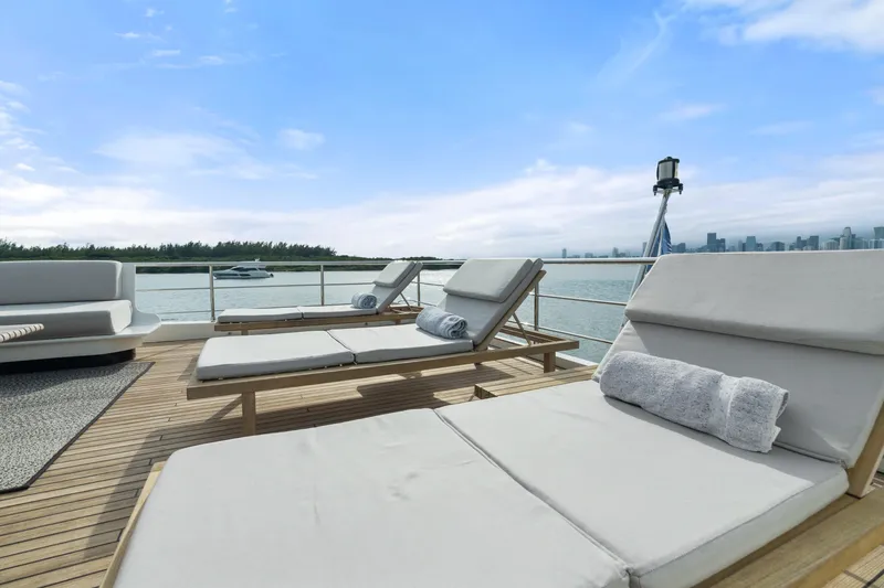 Slide: The Image of Luxury sun loungers on Azimut Grande 32 Metri yacht deck, 2022 model, with scenic ocean view. - 30
