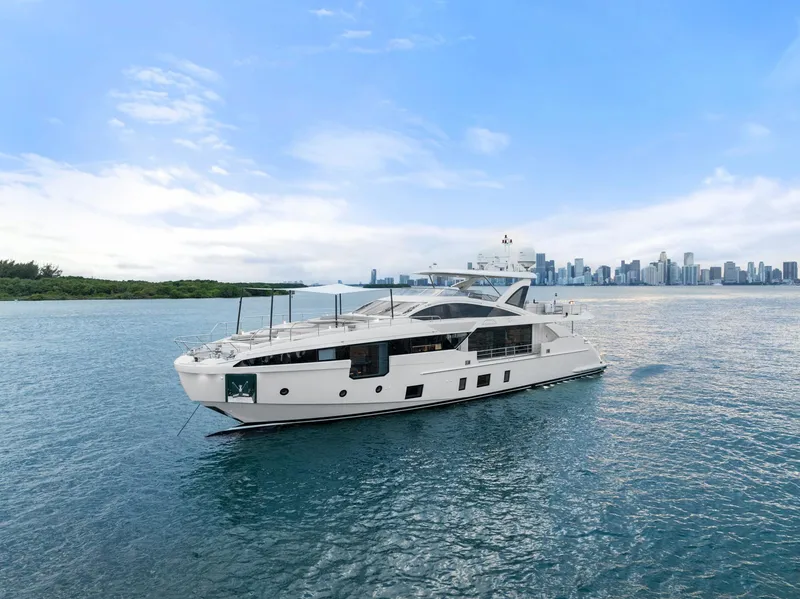 Slide: The Image of Azimut Grande 32 Metri yacht, 2022 model, cruising near a city skyline. - 40