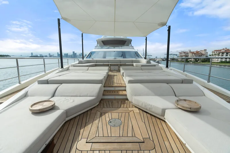Slide: The Image of Luxurious 2022 Azimut Grande 32 Metri yacht deck with sun loungers and ocean view. - 23